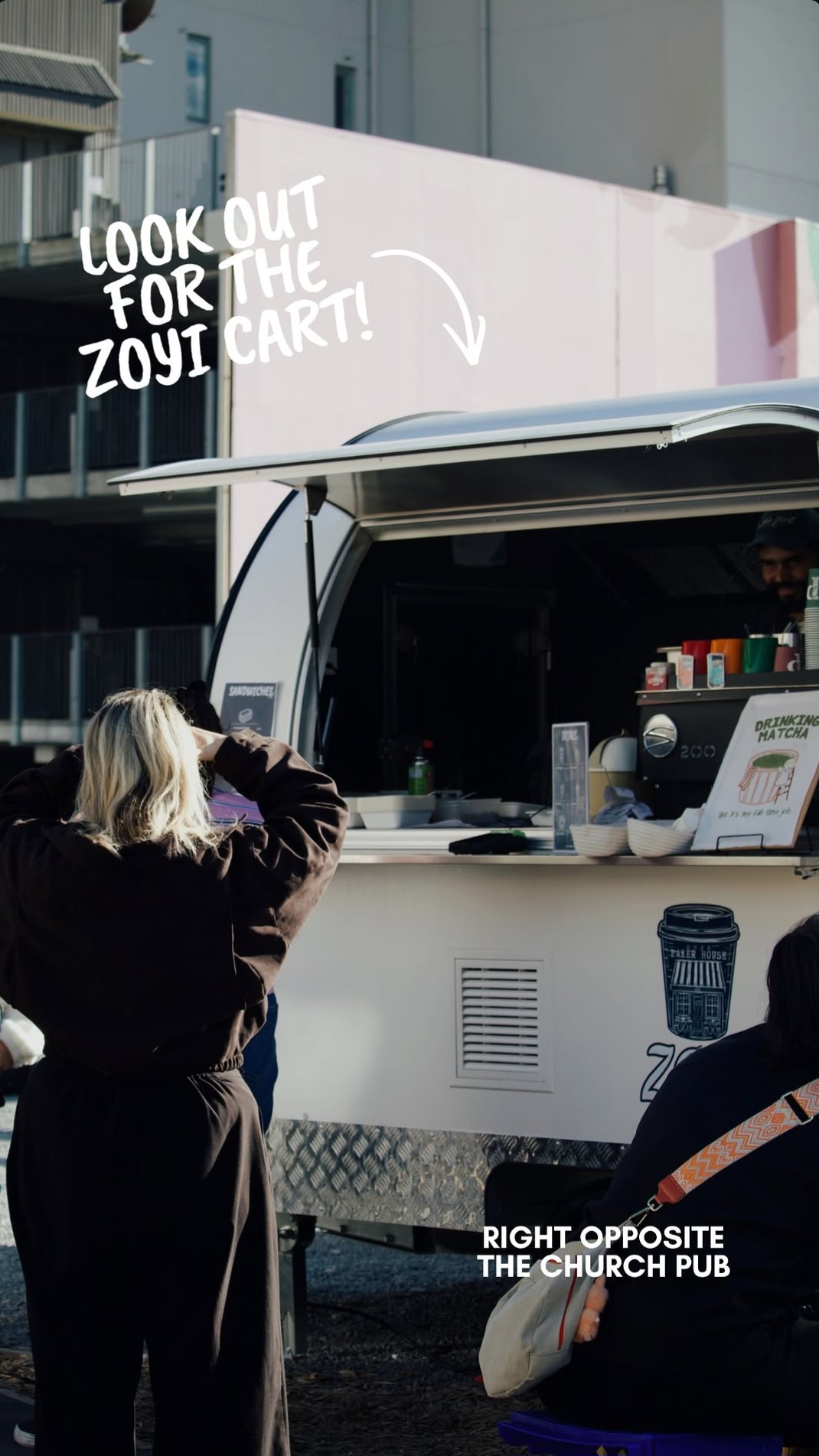The Zoyi BakeHouse cart with a customer at the window